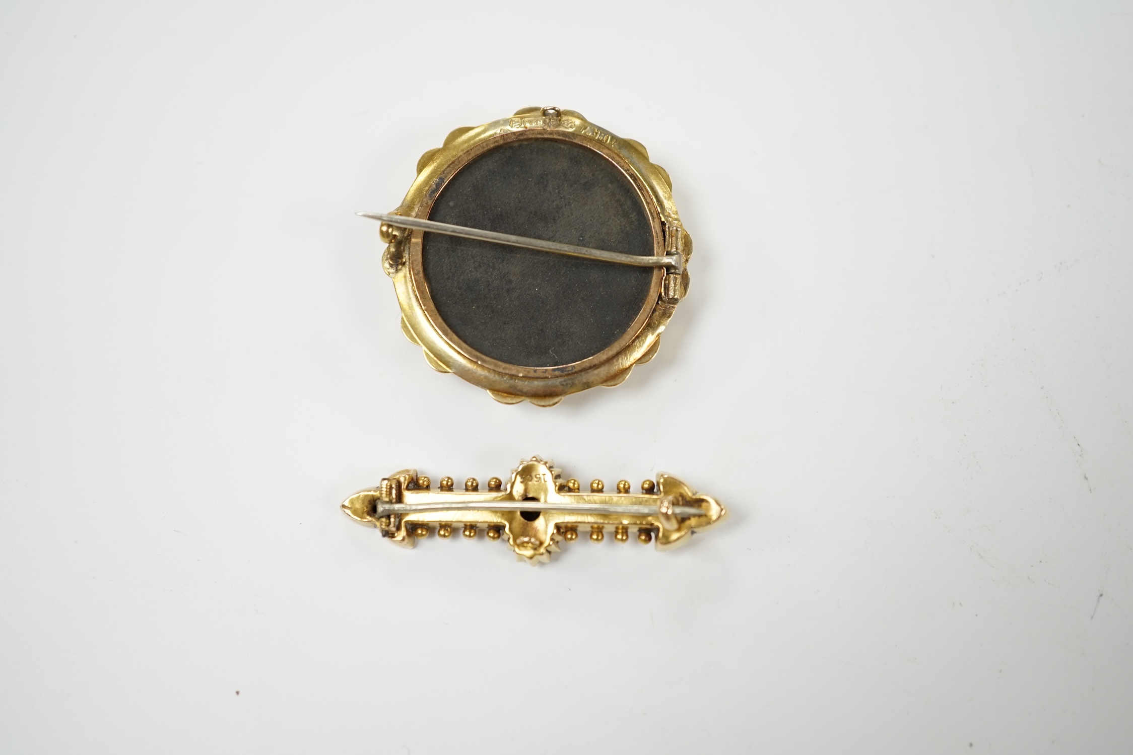 A late Victorian 15ct gold and split pearl set circular brooch, 34mm, gross weight 7.7 grams, together with a yellow metal and diamond chip set bar brooch, gross weight 2.6 grams. Condition - fair